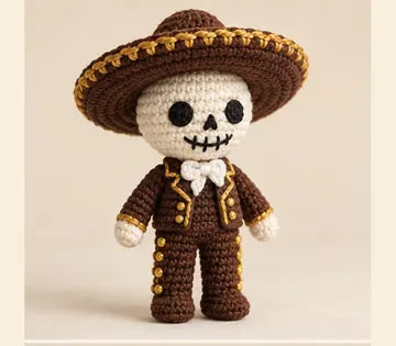 Charro calavera de sombrero café y detalles dorados